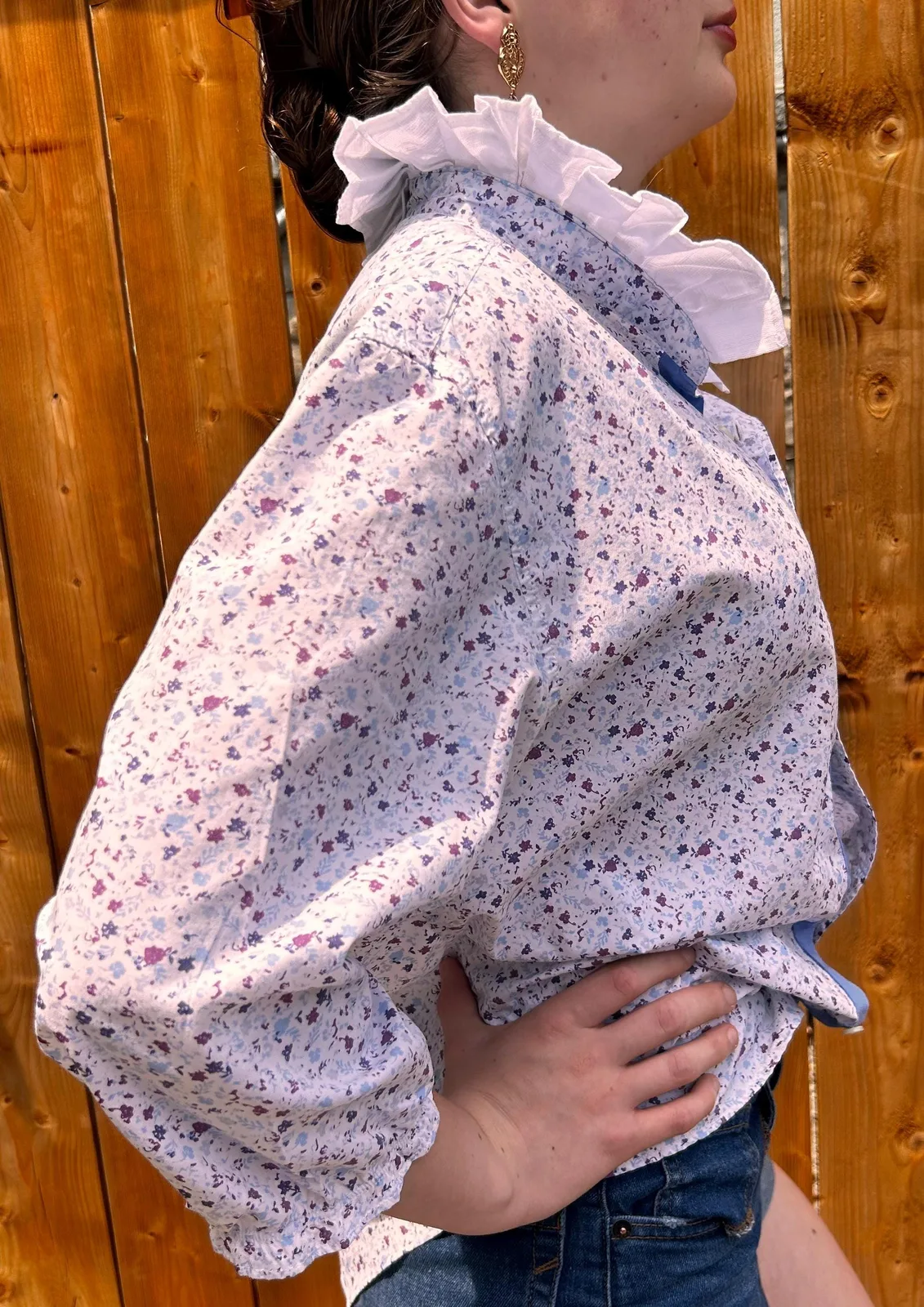 Light floral shirt with a dramatic white ruffle collar